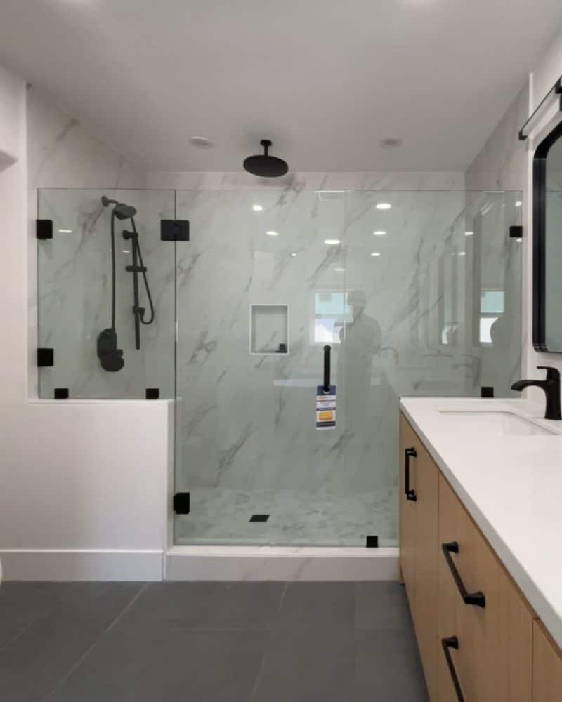Panel door panel frameless shower with half-inch glass in Carlsbad, CA